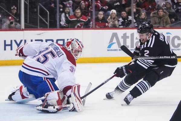 Montembeault makes 37 saves as Canadiens stun Devils 5 2 AP News